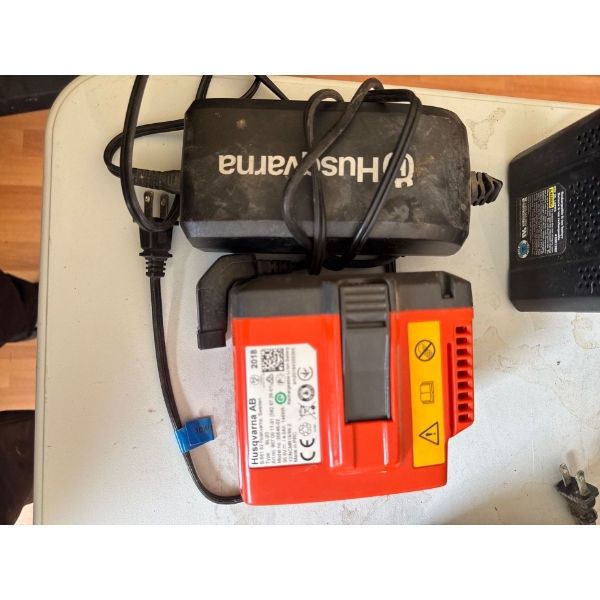  Husqvarna BLi20 36V 4Ah Lithium-Ion Battery and its corresponding charger. 
Capacity: 144 Wh (4.0 A