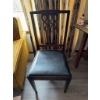 Image 2 : Wooden chair featuring a carved openwork backrest and a black vinyl upholstered seat. The chair has 