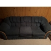 Image 5 : One blue fabric sofa with wood trim and one orange upholstered armchair with tufted back and wide ar