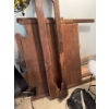 Image 1 : Disassembled wooden bed frame including headboard, footboard, and side rails. The frame shows wear a