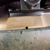 Image 19 : Ruger American bolt-action rifle chambered in 7mm-08 Rem. Features a green speckled synthetic stock,