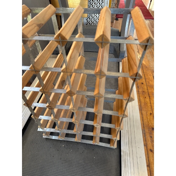 Wine rack with 24 wine spots, it is 16in wide, 24in tall and 9in deep