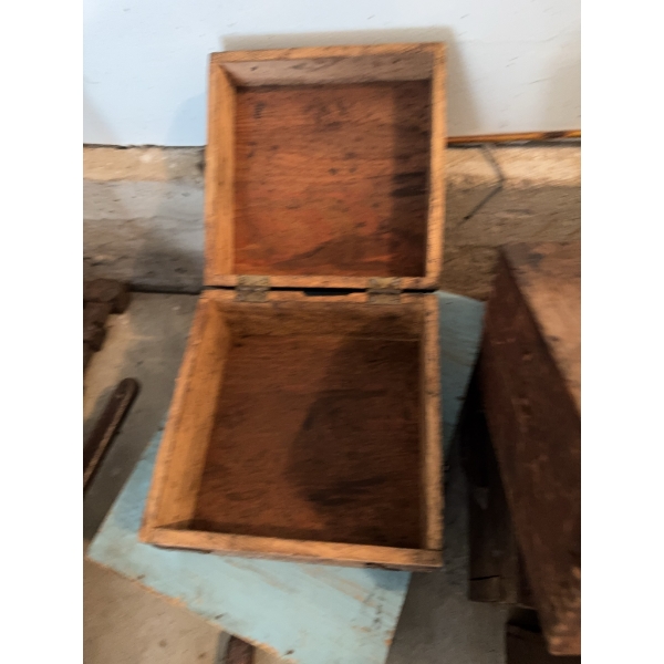 Several assorted wooden boxes, some with hinges and hooks. One box features partial labeling for Gil
