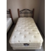 Image 1 :  twin-sized mattress and box spring set with a classic black metal and wood bed frame.