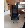 Image 1 : Multiple black office chairs featuring mesh and fabric upholstery, high backs, and armrests. The cha