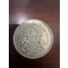 Image 1 : 1960 Canadian 50 cent coin featuring the coat of arms and a portrait of Queen Elizabeth II. The coin