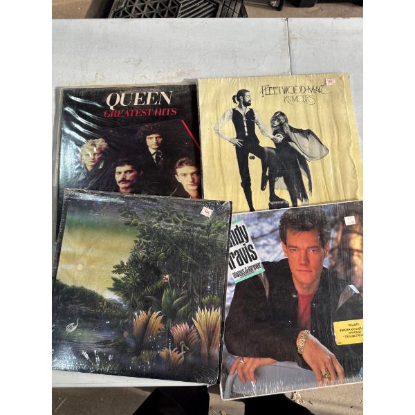 4 vintage records including Randy Travis and Queen