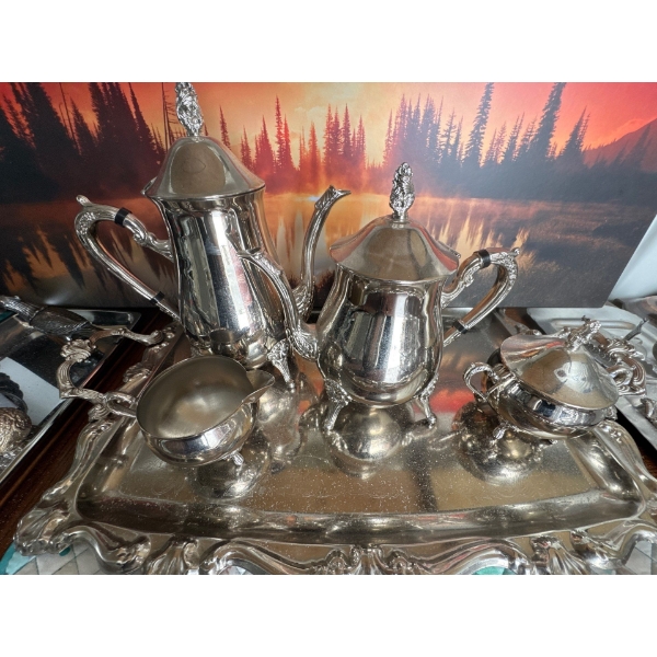 vintage  tea and coffee service set, often featuring ornate handles, feet, and finials