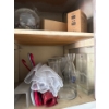 Image 3 : Miscellaneous items in the right cabinet of the laundry room, items include spray paint, pant, paint