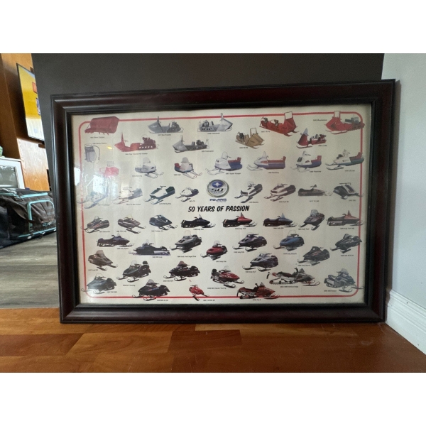  Framed vintage Polaris snowmobile poster celebrating the brand's 50th Anniversary, spanning models 