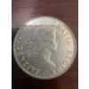 Image 2 : 1958 Canadian 50 cents coin featuring the young portrait of Queen Elizabeth II and the Canadian coat