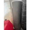 Image 1 : Rubber matting that is 46in wide and 72in long and a roll of plastic wrap