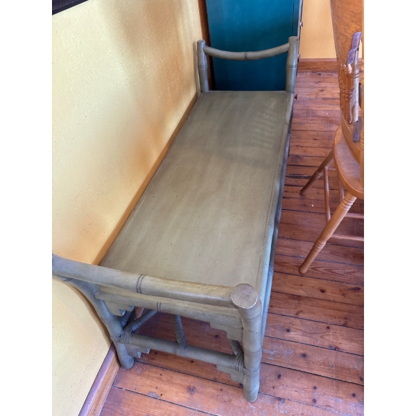 This item is a green-painted vintage Chippendale-style bamboo and rattan side table with a wood boar