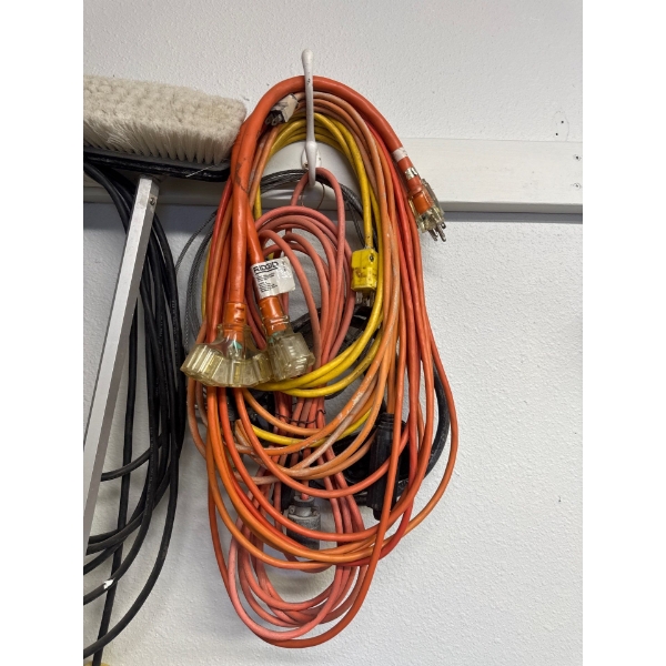  RIDGID brand heavy-duty extension cords, likely the 50 ft. or 100 ft. 12/3 models with lighted TriT