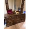 Image 5 : This vintage-style wooden dresser features ornate carved drawer fronts, brass-colored handles, and a