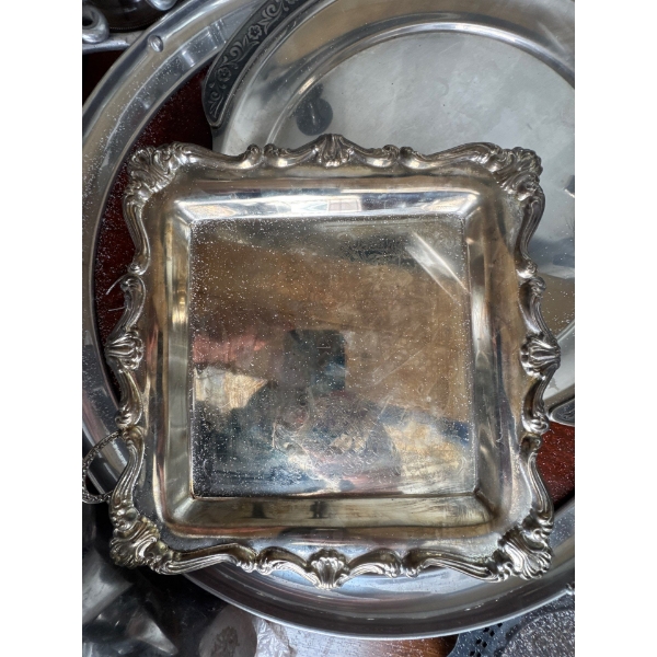 antique or vintage serving tray with an ornate, scalloped border in a style similar to