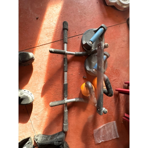 Workout equipment such as a door hanging pull up bar, a couple of 15lb kettle bells and pushup handl