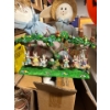Image 1 :  vintage Easter-themed figurine set featuring bunnies on swings, designed by Jaimy in the 1990s. 