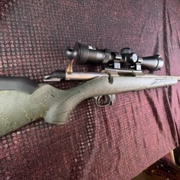 Ruger American bolt-action rifle chambered in 7mm-08 Rem. Features a green speckled synthetic stock,