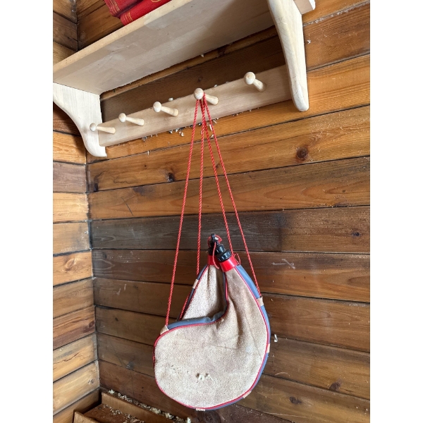 traditional Spanish leather water bottle, often referred to as a bota bag or wineskin. 
Design: It f