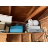 Image 1 : All items located in the corner, including various containers, household equipment, and miscellaneou