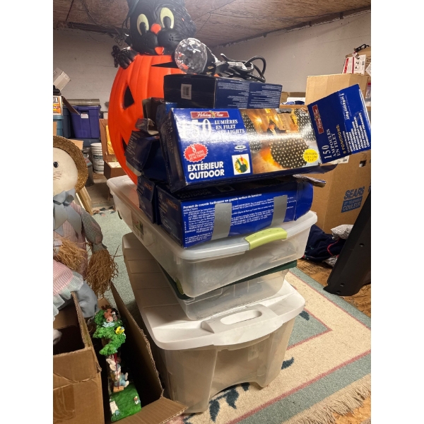 Full totes of Christmas ornaments and lights and Halloween decorations.