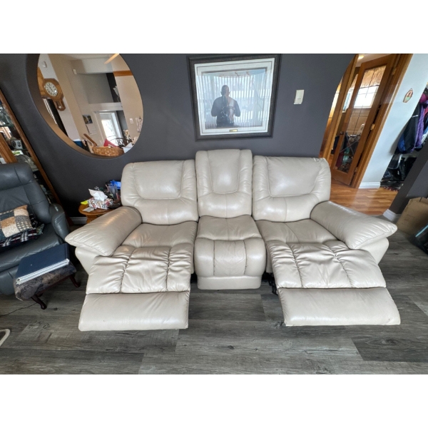 Very nice cream leather couch. Power reclining.very good condition