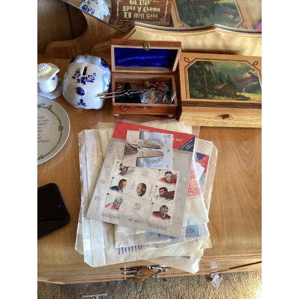 Jewelry boxes, piggy bank, stamp collection.