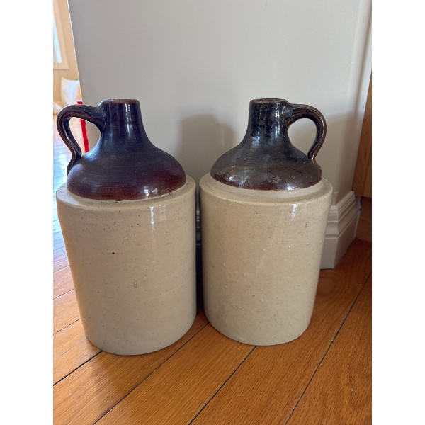  Antique two-tone stoneware jugs, which were commonly used for storing liquids such as whisky, cide