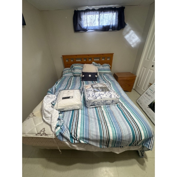Queen bed matching to the dresser.