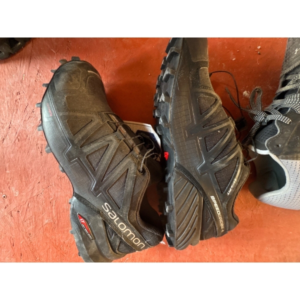 A pair of women's Salomon Speedcross 4 trail running shoes, size 9, brand new