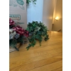 Image 4 :  various artificial plants and floral arrangements in baskets, which are commonly used for seasonal 