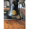 Image 1 : Singer treadle sewing machine, serial number 16165557, featuring original cast iron base and wooden 