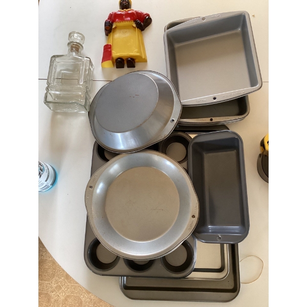 Baking sheets, original Aunt Jemima figurine, whiskey decanter, and muffin trays, serving trays, bak