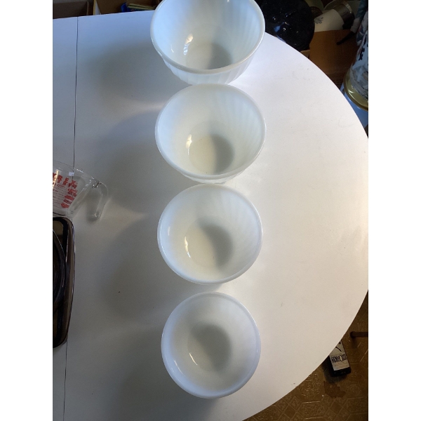 These are vintage Fire-King white milk glass swirl mixing bowls from Anchor Hocking. These popular c