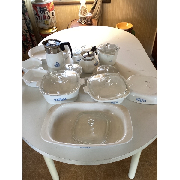 Corning were set and milk containers full of brand new utensils. Lot one nineteen.