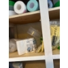 Image 4 : Miscellaneous items in the right cabinet of the laundry room, items include spray paint, pant, paint