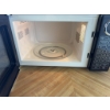 Image 4 : RCA brand microwave oven in black finish. Features digital control panel and turntable. Includes pre