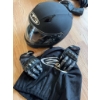 Image 1 : HJC full-face black motorcycle helmet with visor, a pair of Teknic armored gloves, and black leather