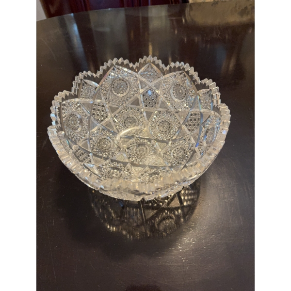 Cut crystal glass bowl featuring a geometric and scalloped edge design. The bowl displays intricate 