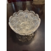 Image 1 : Cut crystal glass bowl featuring a geometric and scalloped edge design. The bowl displays intricate 