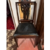 Image 5 : Wooden chair featuring a carved openwork backrest and a black vinyl upholstered seat. The chair has 