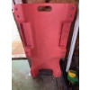 Image 5 : Red plastic rolling creeper with casters, designed for automotive work. Features include built-in ha