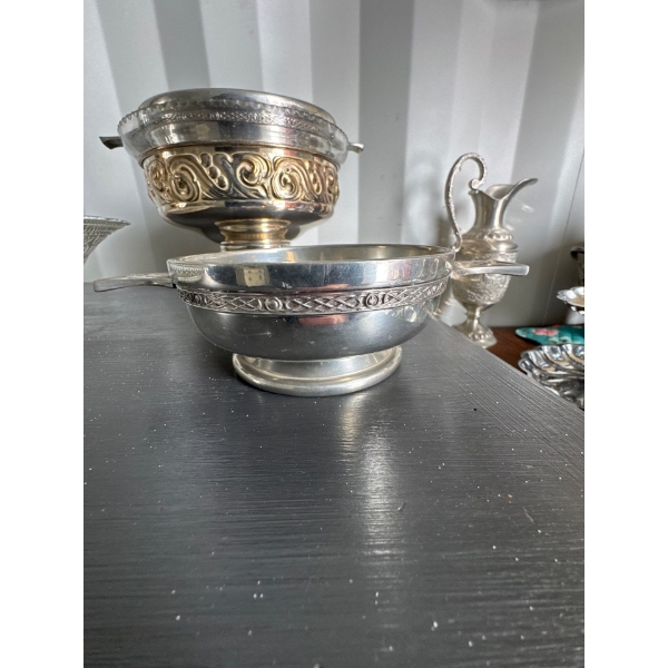 vintage fruit basket featuring a unique double handle, an intricately shaped scallope