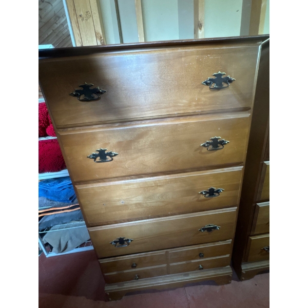 Nice wooden dresser with contents included. Dimensions are 29in wide, 47in tall and 17in deep.