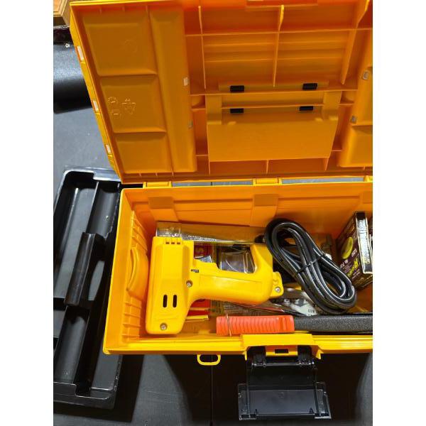 Brand new toolbox with power stapler staples, hand stapler, and multiple fasteners.