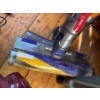 Image 2 : Dyson V8 cordless vacuum cleaner mounted on a charging dock, offers up to 40 minutes of fade free su