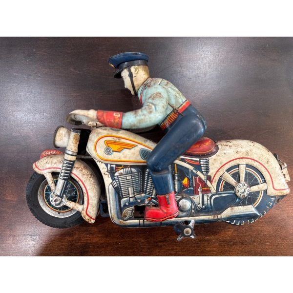  vintage tin lithograph "Tricky Police" motorcycle toy, likely produced by Louis Marx & Co. in the l
