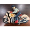 Image 1 :  vintage tin lithograph "Tricky Police" motorcycle toy, likely produced by Louis Marx & Co. in the l