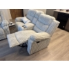Image 2 : This is a corduroy reclining loveseat with a center console and cup holders.